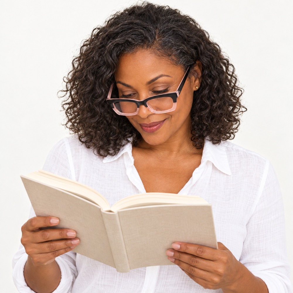Model looking down at a book with Zenix readers perched low on her nose